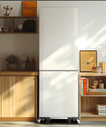 Adjustable Mini Fridge Stand 27.5-35.4 Inches Tall Mobile Base supporting a white refrigerator on four swivel wheels in a kitchen.