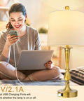 Set Of 2 Touch Control Table Lamps with USB Charging Ports on living room nightstand, modern nickel and gold finish, white drum shade.