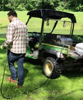 Man spraying lawn with 15 Gallon ATV UTV Spot Sprayer With 18 Inch Spray Wand, 12 Volt Diaphragm Pump, Filtration System, EZ Mount Quick Connect, No Shaft Or Seal Replacements, Translucent White Poly Tank For Lawn Care And Chemical Mixing