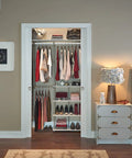 Maximizer Closet Organizer Add On Unit With Four Shelves And Double Hang Rod installed in bedroom closet, holding clothes and shoes.