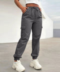 Women Lightweight Quick Dry Cargo Hiking Pants With High Waist Fit All Day Comfort Stretchy Parachute Style Baggy Travel Joggers in grey.