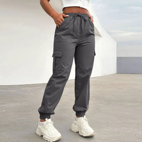 Women Lightweight Quick Dry Cargo Hiking Pants With High Waist Fit All Day Comfort Stretchy Parachute Style Baggy Travel Joggers in grey.