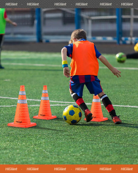 Child practicing soccer with 4 Pack 18 Inch Collapsible Traffic Cones Orange With Reflective Collar For Road Safety Driving Practice And Parking Lot Use Foldable Pop Up Cones High Visibility And Easy Storage In Your Car Or Garage