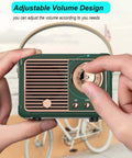 Mini Retro Bluetooth Speaker Portable Wireless Speaker For Home Office Party Outdoor Use Vintage Decor Style Cute Old Fashion Look For iPhone Android Green in hand adjusting volume.