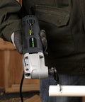 Person using Power Packed Oscillating Multi Tool Kit With 2.4 Amp Motor, 6 Speed Settings From 11000 To 21000 OPM on PVC pipe