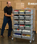 Man pushing metal shelving unit with Locking Swivel Caster Wheels 4 Inch Set of 4 Heavy Duty Pro Grade Expanding Stem