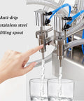 Heavy Duty Double Head Pneumatic Bottle Filler Built Tough Handles One To Forty Bottles Per Minute Stainless Steel Liquid Filling Machine pouring liquid.
