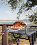 Outdoor setting with Koda 12 Inch Gas Pizza Oven For Outdoor Cooking With 28 Millibar Regulator And Gas Hose Portable Outdoor Pizza Oven