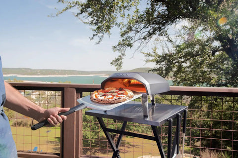 Outdoor setting with Koda 12 Inch Gas Pizza Oven For Outdoor Cooking With 28 Millibar Regulator And Gas Hose Portable Outdoor Pizza Oven
