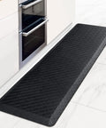 Ergonomic Anti Fatigue Kitchen Floor Mat 4 to 5 inch thick waterproof non slip rug in kitchen setting, black color