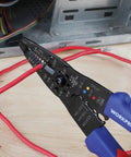 All-In-One 8-Inch Wire Stripper And Multi-Tool Cutter in use, cutting a red wire, showcasing pliers nose and induction hardened edge.