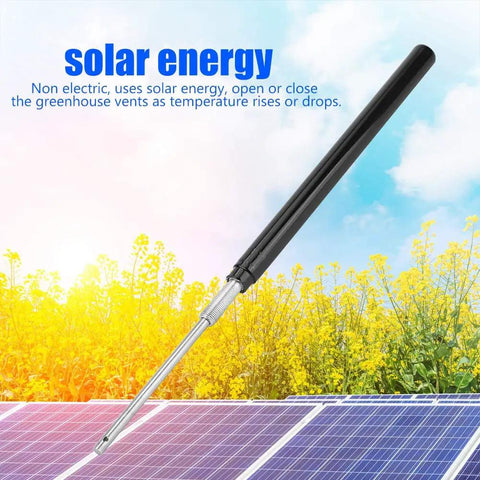 Greenhouse Automatic Vent Opener Kit With Double Spring Roof Control against solar panels and sky background