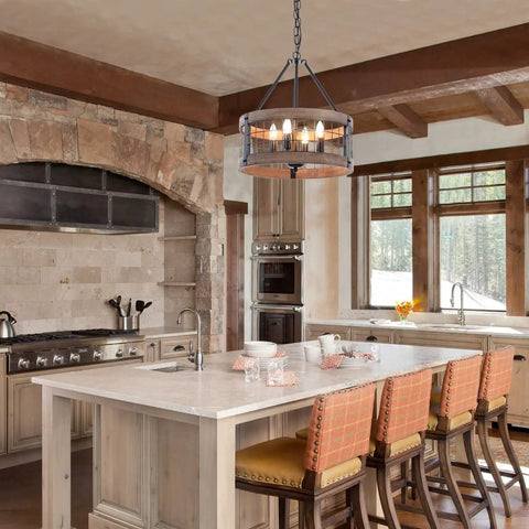 4-Light Farmhouse Drum Chandelier Barn-Inspired With Rustic Wood Rings For Dining Room, Entryway, Kitchen, Bedroom, And Stairway Lighting, Black Metal Finish And Natural Wood Accents, 17.8 Inch Diameter hanging in a modern rustic kitchen.