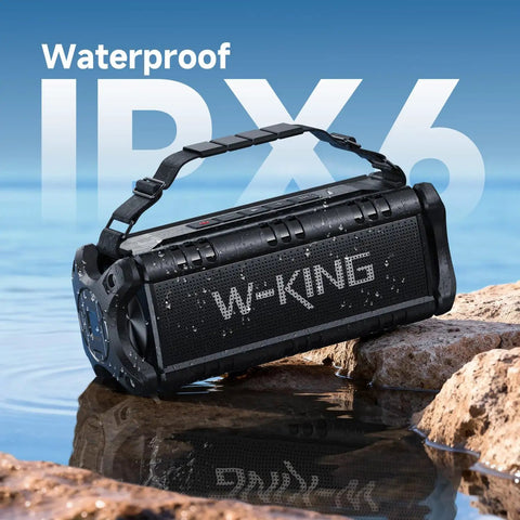 90W Peak Portable Bluetooth Speaker With Beastly Bass Subwoofers And Punchy HD Sound, IPX6 Waterproof on rocks by water