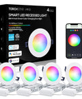 Pack of four Four Inch Smart Recessed Lighting Kit With J Box RGBCW Color Changing LEDs Aluminum Build next to smartphone app