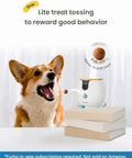 Dog using Mini 360 Degree Pet Camera with treat toss feature for rewarding good behavior