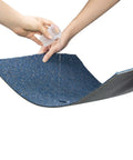 Demonstration of water-resistant property of 20 Pack 20x20 Inch Carpet Tiles With Stickers, Reusable, PVC Backed, Blue.