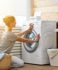 Woman using washer with Slick Clear Dryer Sheet Holder With Lid Fabric Softener Dispenser For Laundry Room Decor on top