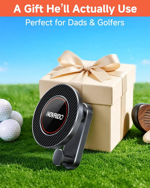 Heavy Duty Magnetic Golf Cart Phone Mount With Cup Hook displayed beside a gift box on grass, ideal for golfers.