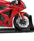 Heavy Duty Upright Motorcycle Wheel Chock Stand Keeps Your Bike Standing Solid In Garage Trailer Or Truck Fits 15 To 22 Inch Wheels And Supports Up To 1800 Pounds For Easy Loading And Safe Transport holding a red motorcycle upright
