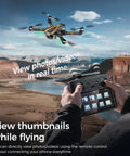 4K EIS Drone With Built In 4 Point 5 Inch Screen for real-time FPV flying over canyon, operator using controller with screen.