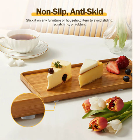 Clear Silicone Cabinet Door Bumpers Set Of 160 Round Half Inch Diameter Super Sticky Self Adhesive Cushions under a wooden tray on a table.