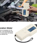 Pro Grade Handheld Digital Vibration Meter Tester checking engine vibrations with display screen in hand outdoors.