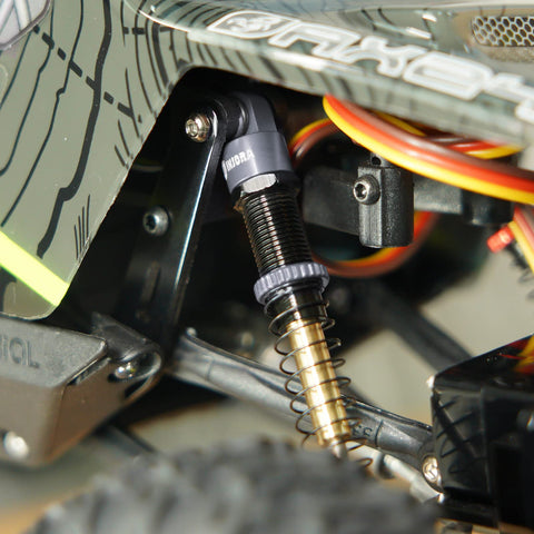 51mm Long Travel Shocks For Axial AX24 SCX24 RC Crawler Upgrade mounted on vehicle, showing CNC Machined Aluminum Bodies and telescopic design.