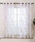 White And Gold See Through Sheer Curtains For Living Room That Let The Sunlight In Light Filtering Window Drapes 90 Inch Long Two Panels Grommet Top With Elegant Wave Pattern Chic Home Vibe hanging on window rod.