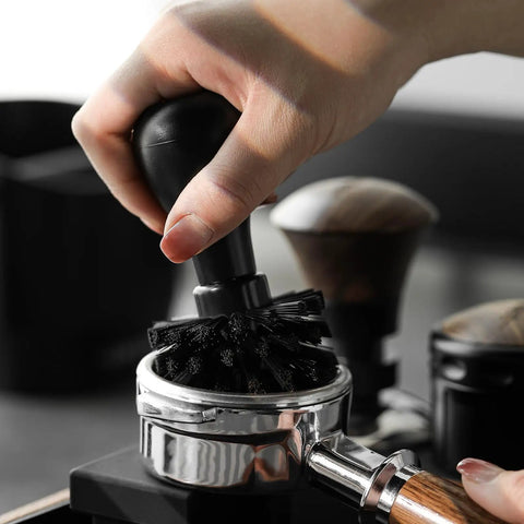 Pro-Grade Espresso Portafilter Brush For 51mm, 54mm, And 58mm Baskets, ABS Handle, Barista Ready Cleaning Tool, Arc Cross Bristles For Quick No-Muss Portafilter Cleanup And Residue Removal shown in use