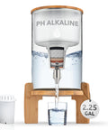 Glass Alkaline Water Dispenser With pH Up To Nine And Filter System, countertop purifier on bamboo stand with glass and filter.