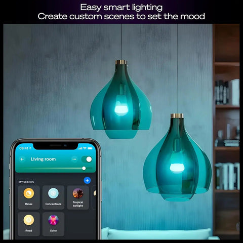 Smart Home Starter Kit With Bridge Pro And Four A19 And E26 Smart Bulbs in blue pendant lights, smart app displayed on phone.