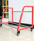 Heavy Duty Wall Mount Wheel Shelf Holds Four Tire Rims Adjustable Garage Storage Rack with red frame and wheels.