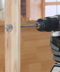 WorkPro spade drill bit installed in a cordless drill drilling into wood