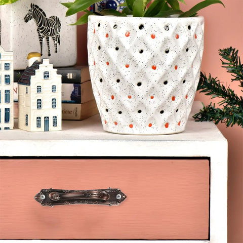 Drawer with Vintage Zinc Alloy Door and Wardrobe Pull Handles Set in Coffee Brown on pink-painted front