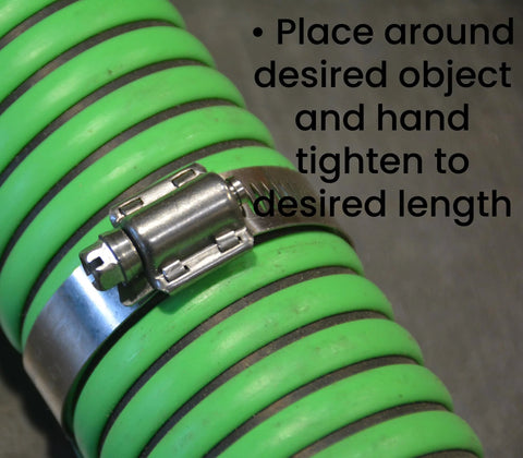 Close-up of a Pro Tie stainless hose clamp installed on a bright green hose; fits 1-1/16 to 2 inches