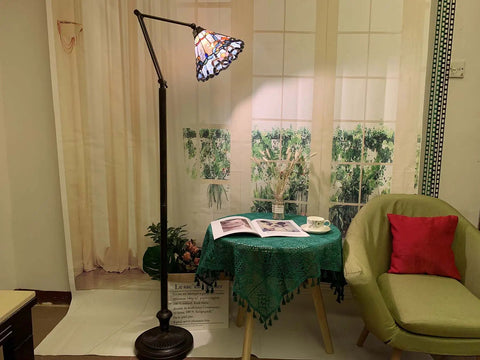 Blue Baroque Tiffany Style Stained Glass Swing Arm Floor Lamp, 75-Inch Tall with 10-Inch Shade in a cozy reading nook