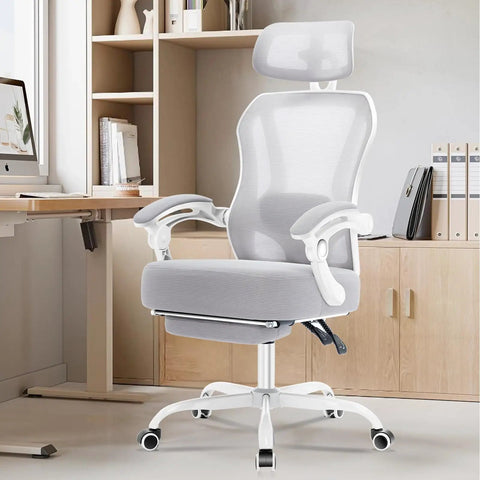 Super Comfy Ergonomic Office Chair With Footrest For All Day Use Ultra Thick Reclining Seat 2D Adjustable Lumbar Support And Headrest High Back Premium Mesh Desk Chair For Home Office Grey in a home office setup