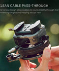 Hydra X Dan Ming High Speed Pan System Pro Kit with tilting base and cable pass-through held by hand.