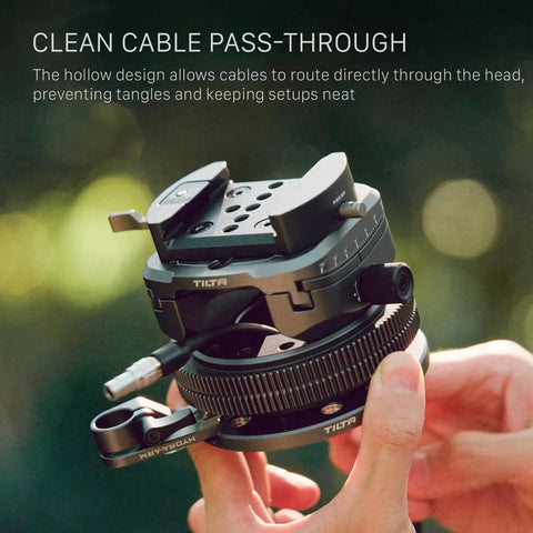 Hydra X Dan Ming High Speed Pan System Pro Kit with tilting base and cable pass-through held by hand.