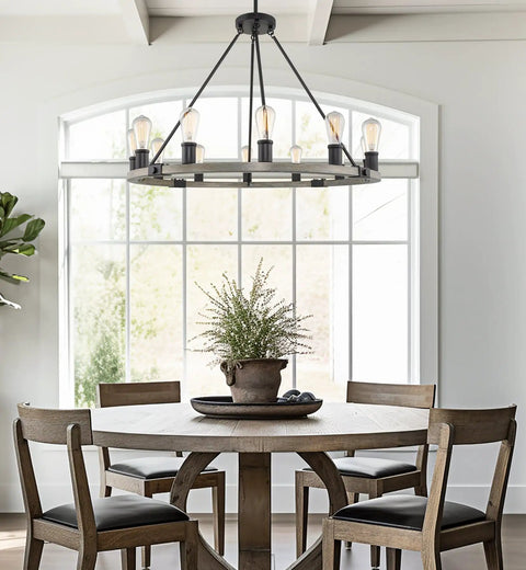 Homestead 25 Inch Six Light Wagon Wheel Chandelier With Gray Oak Wood Finish And Textured Black Accents in dining room setup.