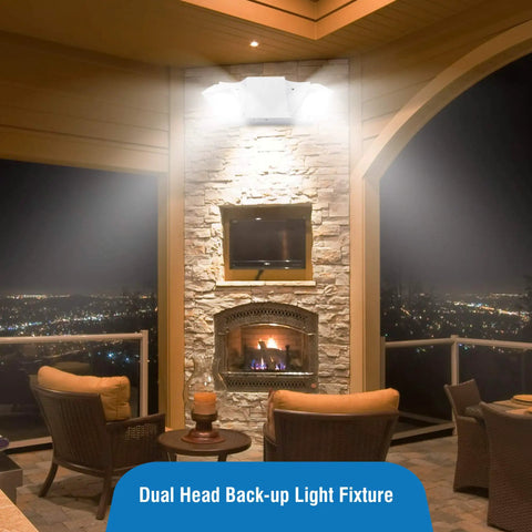 LED Hardwired Emergency Light Kit With Dual Adjustable Heads Backup Battery 6 Pack White installed above patio fireplace at night