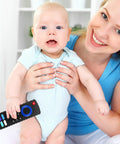 Baby holding TV Remote Shaped Silicone Teething Toy For Babies 3 to 18 Months BPA Free Refrigerator Safe with mother smiling