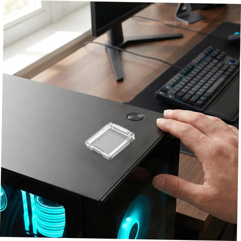 Hand touching a 26mm Button Switch Dustproof Cover With Double-Sided Adhesive on a PC case, preventing accidental presses.