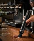 Rechargeable Mini Coffee Grinder Vacuum Cleaner with 4 Attachments cleaning espresso machine workspace.
