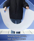 Person holding a flexible, white sheet demonstrating the durability of the Heavy Duty Appliance Sliders With Pull Strap 48 By 29 Inches Moving Mat.
