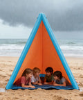 Children under 2-In-1 Sand Free Beach Blanket And Tent, 79 By 83 Inch Waterproof Picnic Blanket With Built-In Inflatable Pillows, on beach.