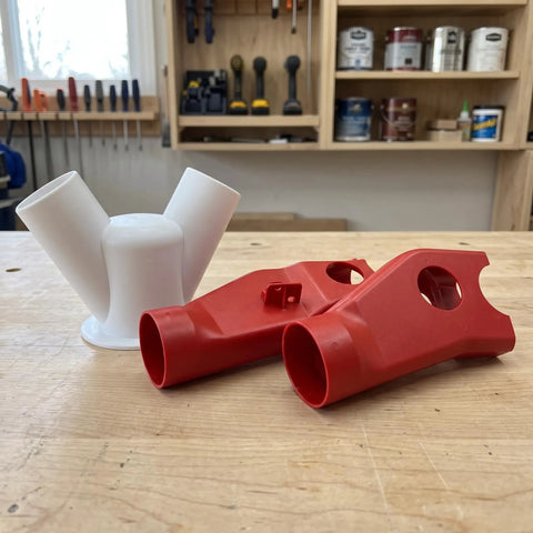 Heavy Duty Red Dust Hood For Machinery And Automatic Dust Collection Systems, red plastic connectors on workbench.