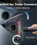 Plug And Play Level 2 Tesla Charger 32 Amp Portable Ev Charging Station With 20 Ft Cable 240V Nema 14-50 near Tesla connector close-up.
