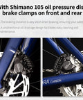 Shimano 105 oil pressure disc brake clamps on a full carbon fiber road bike for adults, showing front and rear details.